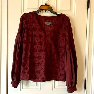 Women's burgundy cotton top with eyelet detailing.